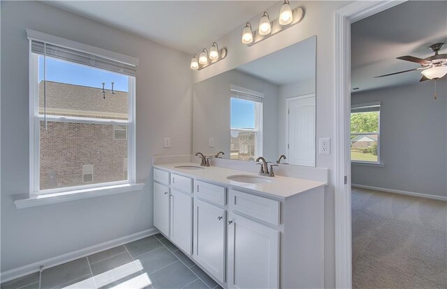 237 Chiswick Loop, Stockbridge, GA 30281 - bathroom with ceiling fan, baseboards, a sink, and double vanity