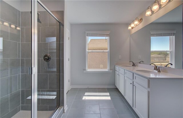 237 Chiswick Loop, Stockbridge, GA 30281 - bathroom featuring a stall shower, tile patterned floors, a sink, and a healthy amount of sunlight