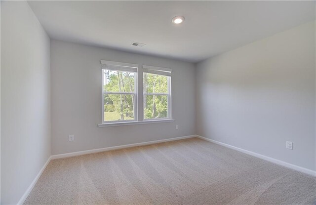 237 Chiswick Loop, Stockbridge, GA 30281 - unfurnished room featuring light carpet, visible vents, and baseboards