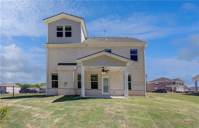 237 Chiswick Loop, Stockbridge, GA 30281 - rear view of house featuring a lawn, brick siding, a patio area, and a ceiling fan
