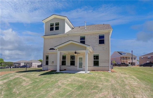 237 Chiswick Loop, Stockbridge, GA 30281 - rear view of property featuring brick siding, a yard, a patio, and ceiling fan