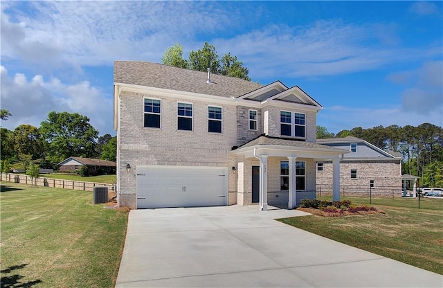 237 Chiswick Loop, Stockbridge, GA 30281 - traditional home featuring fence, an attached garage, a front lawn, and cooling unit