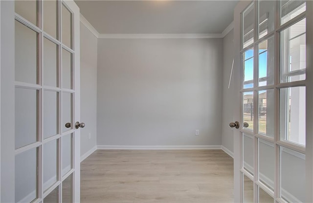 237 Chiswick Loop, Stockbridge, GA 30281 - spare room featuring light wood finished floors, baseboards, ornamental molding, and french doors