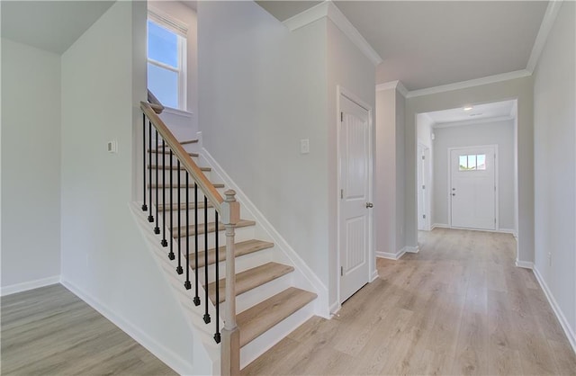 237 Chiswick Loop, Stockbridge, GA 30281 - stairs featuring baseboards, ornamental molding, and wood finished floors
