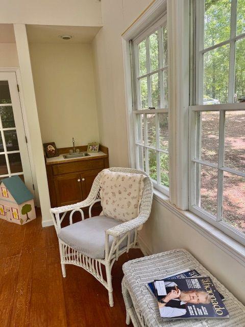 408 Hasty Trl, Canton, GA 30115 - living area featuring plenty of natural light and dark wood finished floors