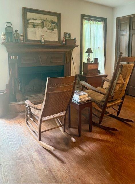 408 Hasty Trl, Canton, GA 30115 - sitting room with wood finished floors and a fireplace