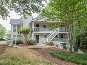 rear view of house with a porch