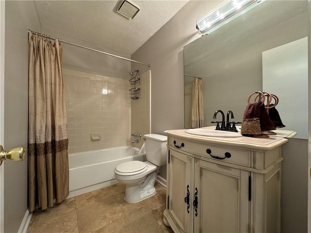 full bathroom featuring vanity, shower / bath combination with curtain, a textured ceiling, and toilet