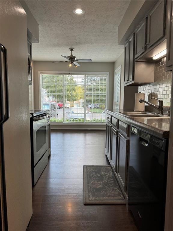 kitchen with decorative backsplash, appliances with stainless steel finishes, a healthy amount of sunlight, and sink