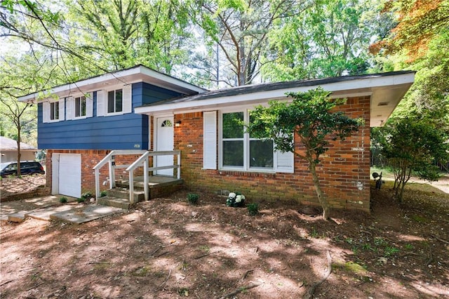 5287 Chantilly Ter, Atlanta, GA 30349 - tri-level home with brick siding and an attached garage