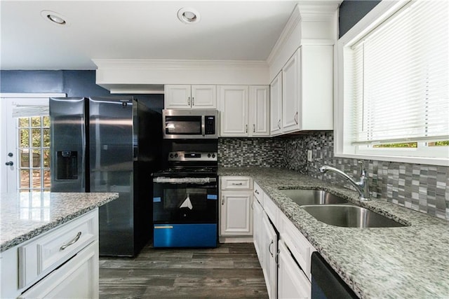 5287 Chantilly Ter, Atlanta, GA 30349 - kitchen with a sink, white cabinetry, and stainless steel appliances
