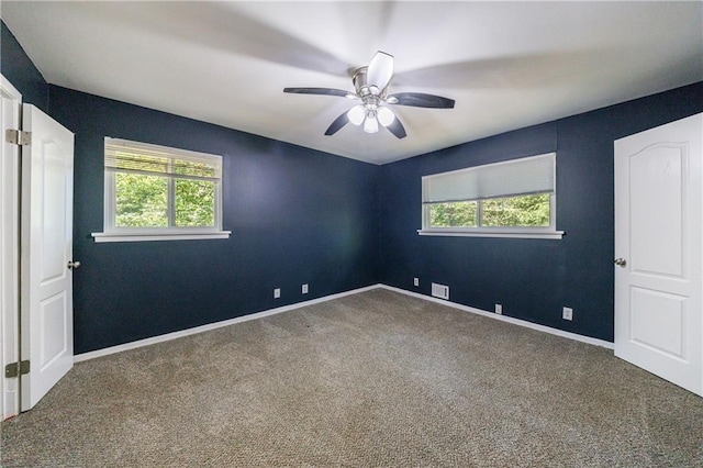 5287 Chantilly Ter, Atlanta, GA 30349 - unfurnished room with carpet flooring, ceiling fan, plenty of natural light, and baseboards
