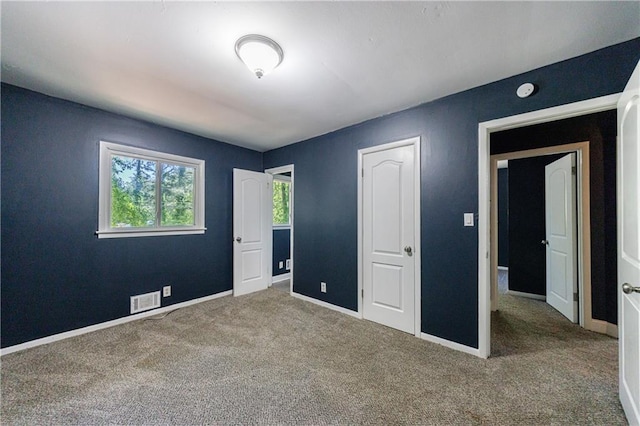 5287 Chantilly Ter, Atlanta, GA 30349 - unfurnished bedroom with carpet, visible vents, and baseboards