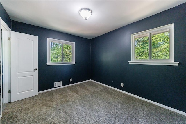5287 Chantilly Ter, Atlanta, GA 30349 - unfurnished room featuring visible vents, baseboards, carpet, and a healthy amount of sunlight