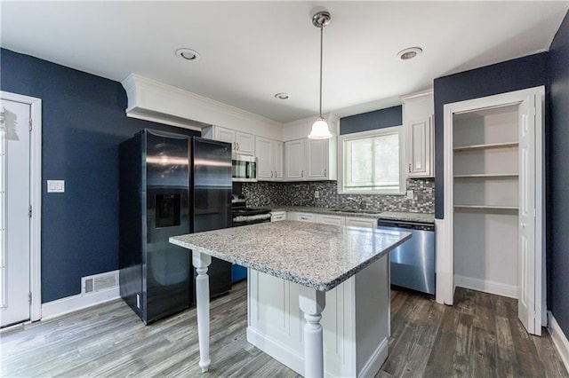 5287 Chantilly Ter, Atlanta, GA 30349 - kitchen with tasteful backsplash, white cabinetry, visible vents, appliances with stainless steel finishes, and a sink