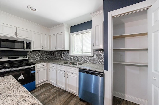 5287 Chantilly Ter, Atlanta, GA 30349 - kitchen with white cabinets, a sink, backsplash, and appliances with stainless steel finishes
