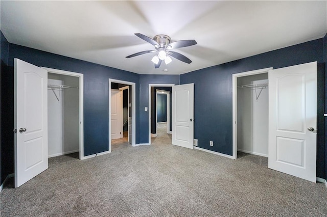 5287 Chantilly Ter, Atlanta, GA 30349 - unfurnished bedroom with two closets, ceiling fan, baseboards, and carpet