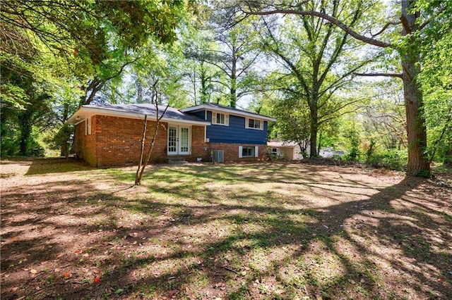 5287 Chantilly Ter, Atlanta, GA 30349 - rear view of property featuring brick siding, french doors, and cooling unit