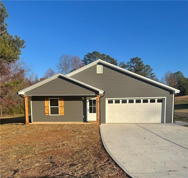 ranch-style home featuring a garage