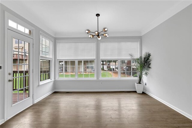 2207 Concordia Way SE Unit 12, Mableton, GA 30126 - unfurnished sunroom with a chandelier, wood finished floors, and baseboards