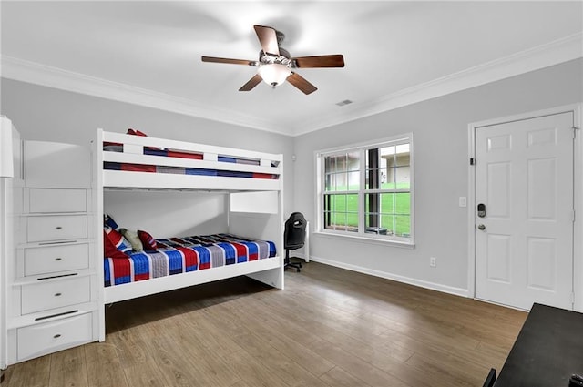 2207 Concordia Way SE Unit 12, Mableton, GA 30126 - bedroom featuring crown molding, wood finished floors, baseboards, and ceiling fan