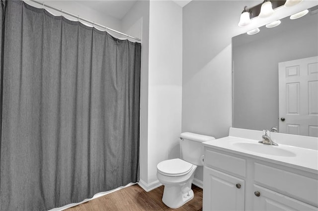2207 Concordia Way SE Unit 12, Mableton, GA 30126 - bathroom featuring wood finished floors, toilet, vanity, and curtained shower