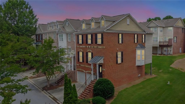2207 Concordia Way SE Unit 12, Mableton, GA 30126 - view of front facade with brick siding, a garage, a front yard, and a residential view