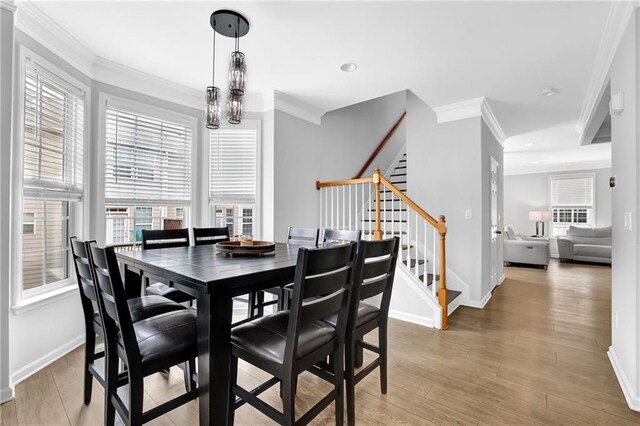 2207 Concordia Way SE Unit 12, Mableton, GA 30126 - dining room featuring stairway, ornamental molding, light wood-type flooring, baseboards, and recessed lighting