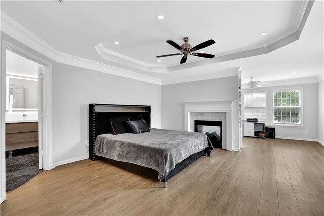 2207 Concordia Way SE Unit 12, Mableton, GA 30126 - bedroom featuring a high end fireplace, a tray ceiling, wood finished floors, crown molding, and recessed lighting