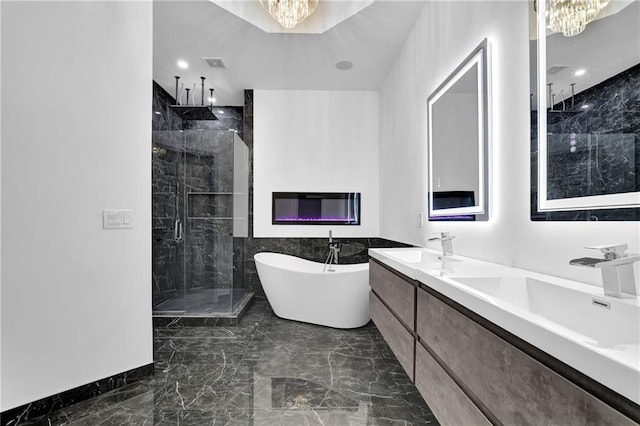 2207 Concordia Way SE Unit 12, Mableton, GA 30126 - full bathroom featuring a chandelier, marble tiled flooring, a shower stall, a soaking tub, and recessed lighting