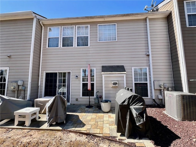 back of house featuring a patio and central AC unit