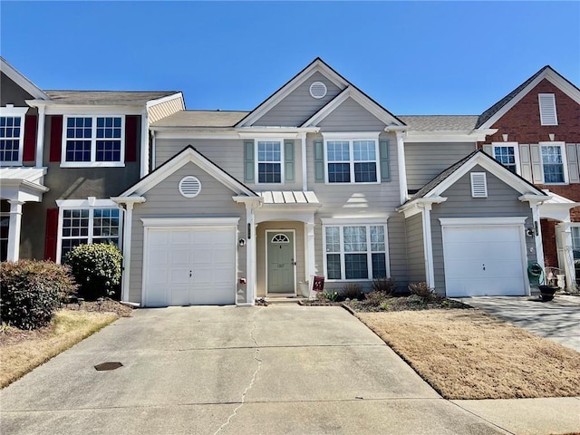 townhome / multi-family property with concrete driveway and an attached garage