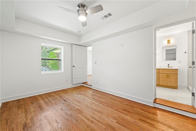2146 Trailwood Rd, Decatur, GA 30032 - unfurnished bedroom featuring light wood-type flooring, baseboards, ensuite bath, and visible vents