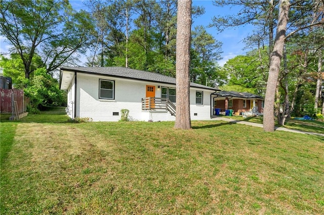 2146 Trailwood Rd, Decatur, GA 30032 - view of front of home with brick siding, crawl space, a front yard, and fence