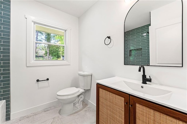 2146 Trailwood Rd, Decatur, GA 30032 - bathroom with walk in shower, baseboards, vanity, and toilet