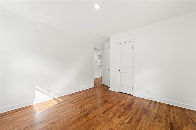 2146 Trailwood Rd, Decatur, GA 30032 - unfurnished room featuring baseboards, wood finished floors, and recessed lighting