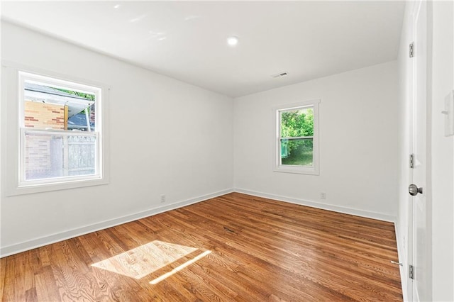 2146 Trailwood Rd, Decatur, GA 30032 - spare room with baseboards, wood finished floors, and visible vents