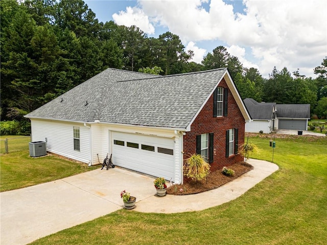 15 Fairwoods Ct, Covington, GA 30016 - view of home's exterior featuring a shingled roof, driveway, an attached garage, and a lawn