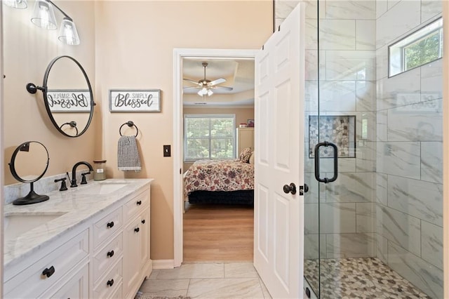 15 Fairwoods Ct, Covington, GA 30016 - bathroom with ensuite bath, healthy amount of natural light, ceiling fan, and double vanity