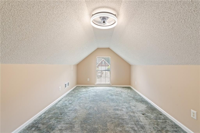 15 Fairwoods Ct, Covington, GA 30016 - bonus room with a textured ceiling, carpet floors, and vaulted ceiling