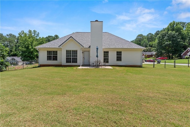 15 Fairwoods Ct, Covington, GA 30016 - rear view of property featuring a patio area, a chimney, and a shingled roof