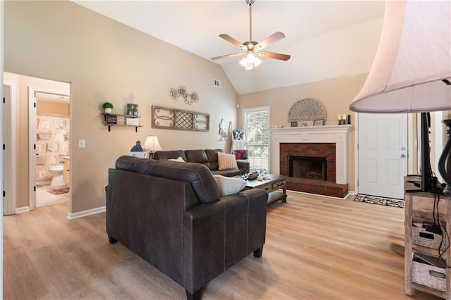 15 Fairwoods Ct, Covington, GA 30016 - living room with a ceiling fan, light wood-style flooring, high vaulted ceiling, and a fireplace