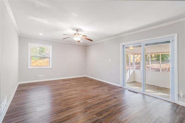 spare room featuring dark hardwood / wood-style floors, ceiling fan, and ornamental molding