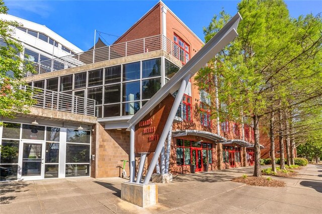 572 Edgewood Ave SE Unit # 106, Atlanta, GA 30312 - rear view of property with brick siding and stairs