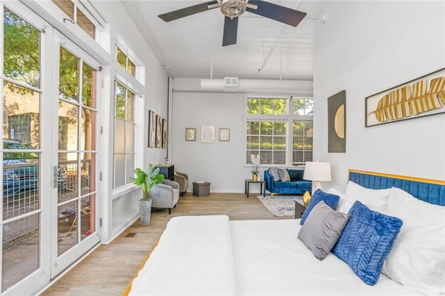 572 Edgewood Ave SE Unit # 106, Atlanta, GA 30312 - bedroom with visible vents, a ceiling fan, and wood finished floors