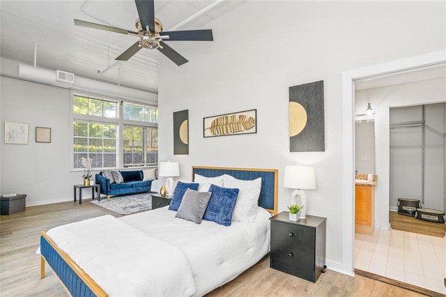 572 Edgewood Ave SE Unit # 106, Atlanta, GA 30312 - bedroom with a high ceiling, wood finished floors, visible vents, and baseboards