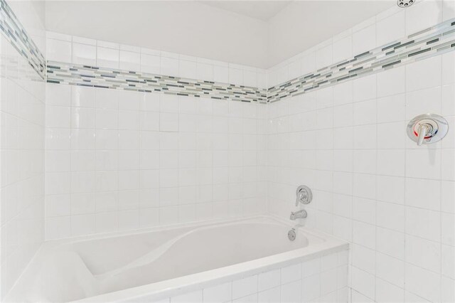 572 Edgewood Ave SE Unit # 106, Atlanta, GA 30312 - bathroom featuring a tub to relax in and a shower