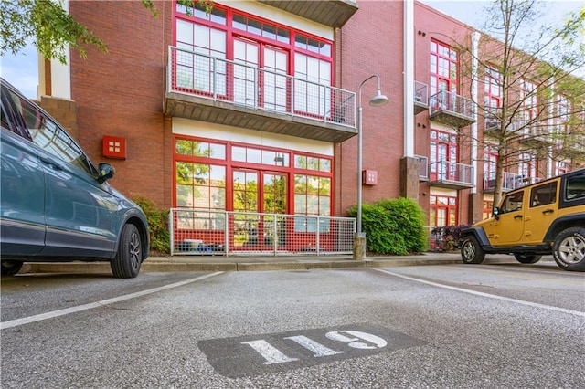 572 Edgewood Ave SE Unit # 106, Atlanta, GA 30312 - view of building exterior featuring uncovered parking