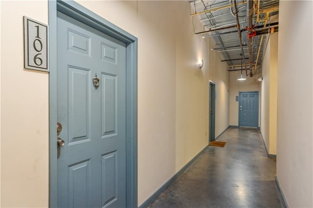572 Edgewood Ave SE Unit # 106, Atlanta, GA 30312 - hallway featuring finished concrete flooring and baseboards