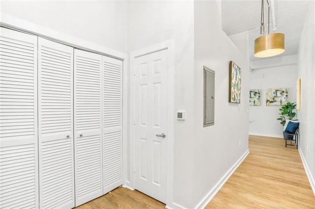 572 Edgewood Ave SE Unit # 106, Atlanta, GA 30312 - corridor with baseboards, electric panel, and light wood-style flooring